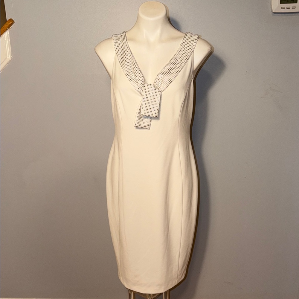 Calvin Klein Ladies white Sleeveless Sheath Dress with Rhinestone neckline.